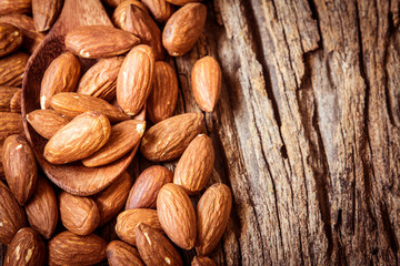 close up Peeled almonds nut  on wooden  background