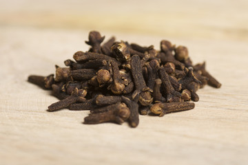 closeup of carnation, cloves on wooden background