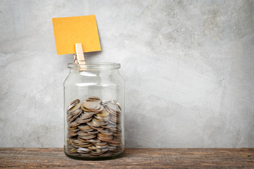 Glass jar with coins.