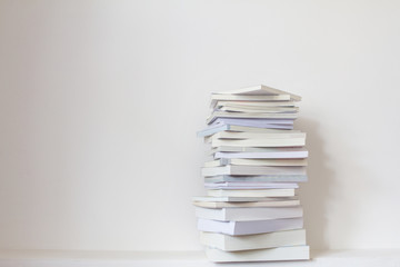 Close up book stacked  with concrete wall background