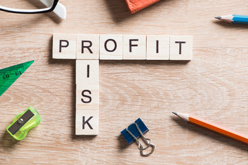 Conceptual business keywords on table with elements of game making crossword