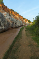 Landscape with river between red rocks and jungle Ham Tien canyon Mui ne, Vietnam