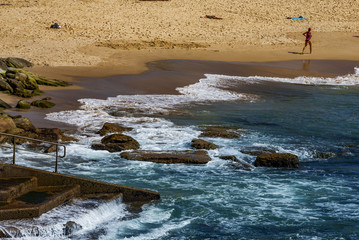 People relaxing on the Bondi beach in Sydney, Australia. Bondi beach is one of the most famous beach in the world.