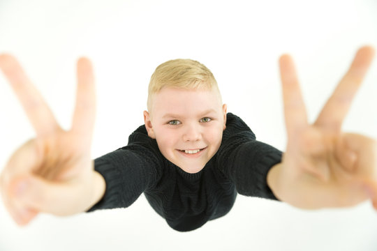 The boy gesture to the camera. View from above