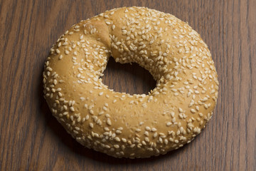 sesame bagels on wooden background