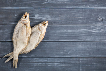 Dried fish on a wooden table.