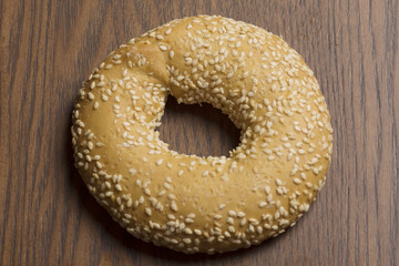 sesame bagels on wooden background