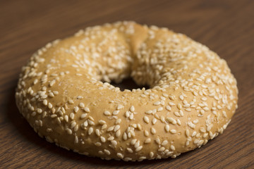 sesame bagels on wooden background