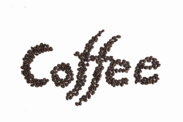 The word Coffee spelled with hundreds of coffee beans. Isolated against white background