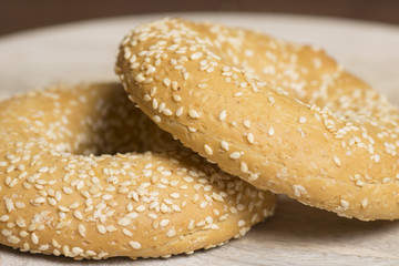 sesame bagels on wooden background
