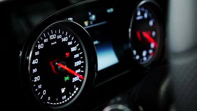 In Car on the instrument panel shows the operability of all systems. On the black panel mounted speedometer and other sensors that react to the motor car factory and other mechanisms. Red arrows are
