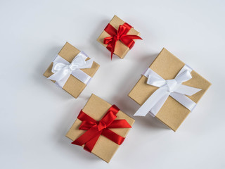 Wrapped vintage gift box with red and white ribbon bow

