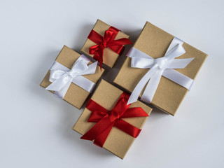 Wrapped vintage gift box with red and white ribbon bow

