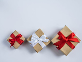 Wrapped vintage gift box with red and white ribbon bow

