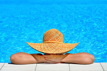 Real female beauty relaxing at swimming pool