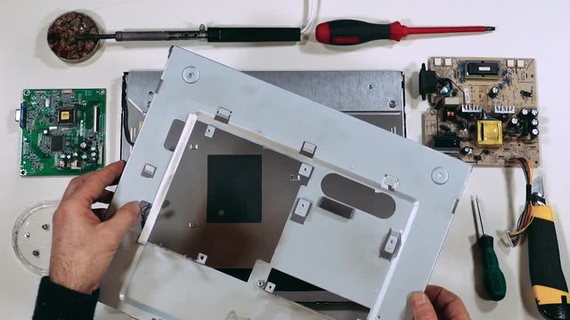Master repair the monitor, with tools on the tabel, electronic, first-person view. 60fps.
