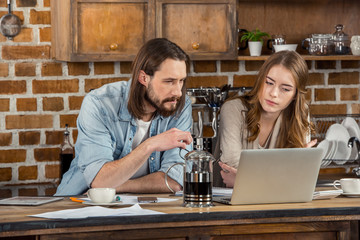Couple using laptop