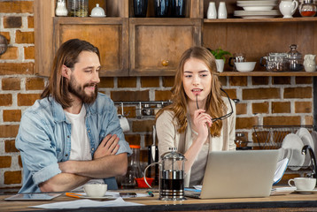 Couple using laptop