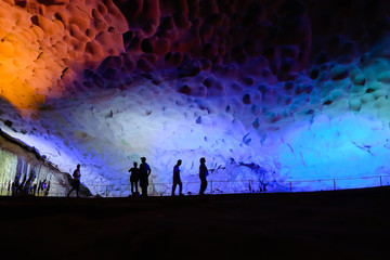 Colorful illumination in Surprise Cave in Halong Bay, Vietnam