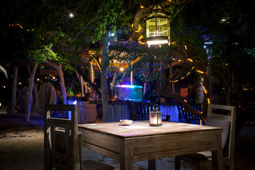 A romantic private beach dinner with candles