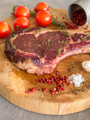 Raw marbled meat steaks on wood , top view, close up