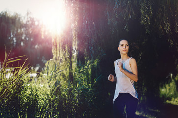 Beautiful female jogger running outside