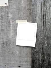 Single blank square frame on gray wooden boards background