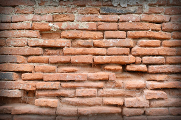 Weathered stained old brick wall background