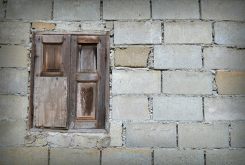 Old brick wall with window
