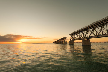 Fototapeta na wymiar Remains of Bahia Honda railroad bridge in Florida Keys at sunset 
