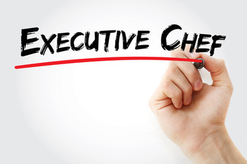 Hand writing executive chef with marker, concept background