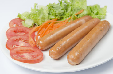 Grilled sausages and vegetables on a plate