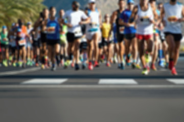 Marathon running race people feet on city road,abstract blurry - obrazy, fototapety, plakaty