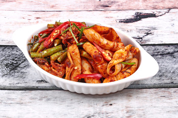 Spicy fried cowpea and squid with roasted chile paste.