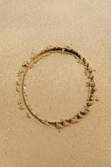 Number 0. Sand Alphabet: digits. Concept holiday background.