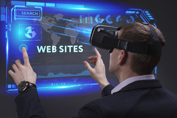 Business, Technology, Internet and network concept. Young businessman working on a virtual screen of the future and sees the inscription: Web sites