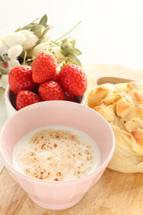 Cheese bread on wooden board with milk