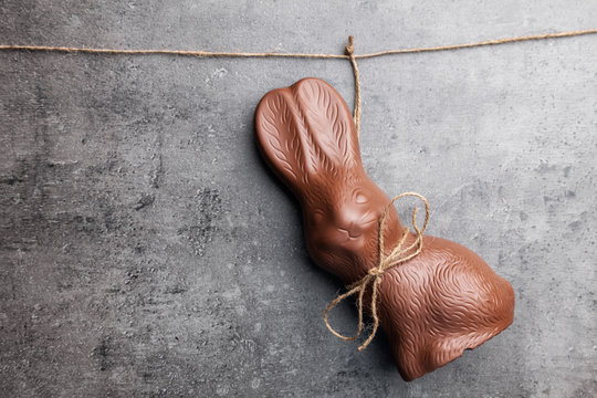 Delicious Easter chocolate bunny hanging on a string