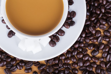 Coffee cup with sugar and beans