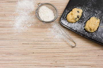 Make cookies. Form for baking French madeleine cookies and strainer with flour. The dough in a baking dish. How to make pastry. Step by step. Copy space