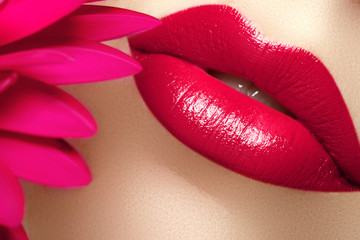 Beauty and spa salon. Close-up of a beautiful sexy red lips.