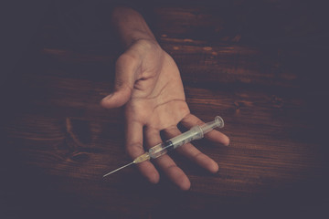 Young man with heroin - obrazy, fototapety, plakaty
