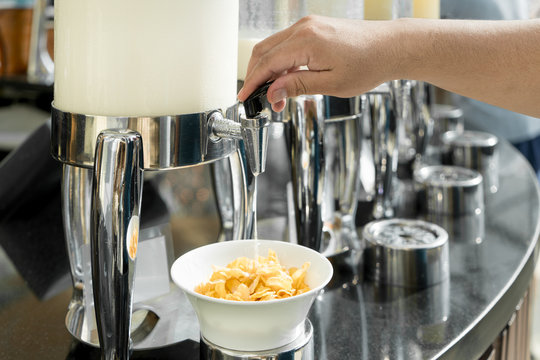 Cereals and fresh maik on the table in buffet breakfast in the restaurant. Healthy food.