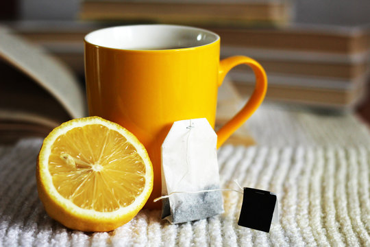Yellow tea cup and lemon, hot drink