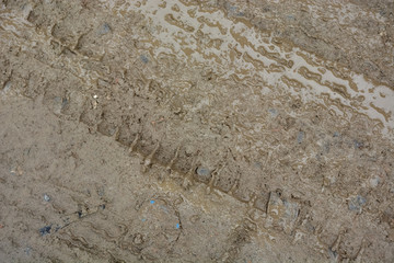 wheel track on dirty soil.