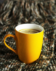 Bright yellow cup of tea, a pleasant and joyful day