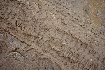 wheel track on dirty soil.