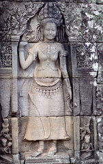 Ancient relief with smiling Apsara in Angkor Temple, Cambodia