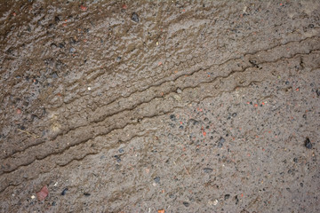 wheel track on dirty soil.