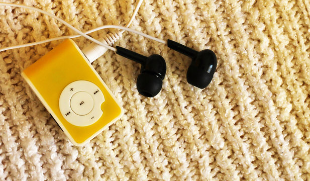 Bright yellow player with headphones